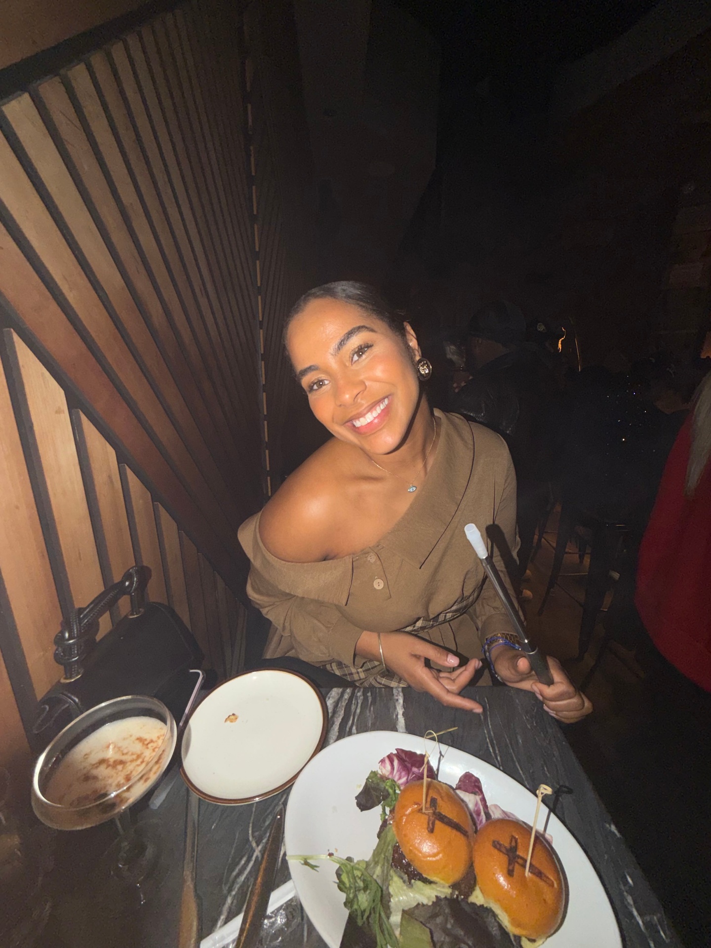 Guest enjoying a session and bites at the Heroes Hookah lounge